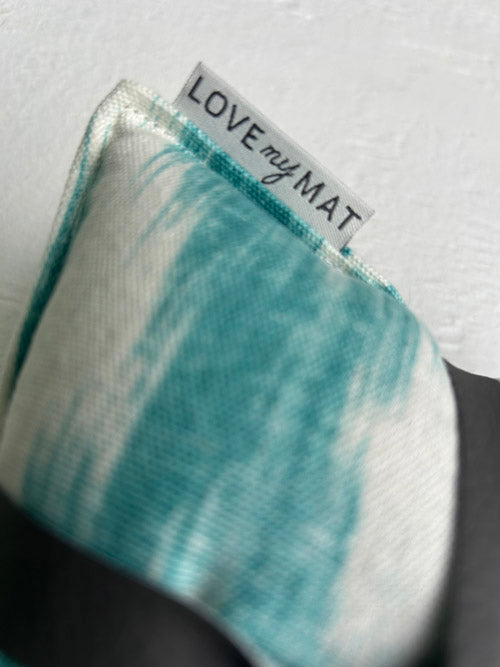 Teal knee cushion with 'LOVE my MAT' label on a white background