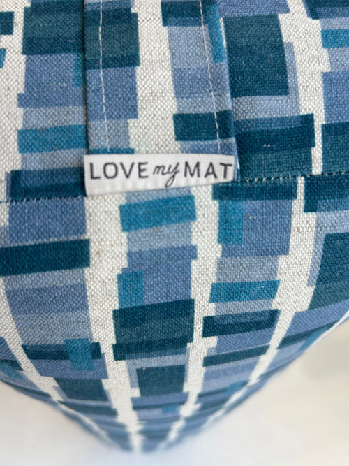 Blue geometric patterned yoga bolster with 'LOVE my MAT' label