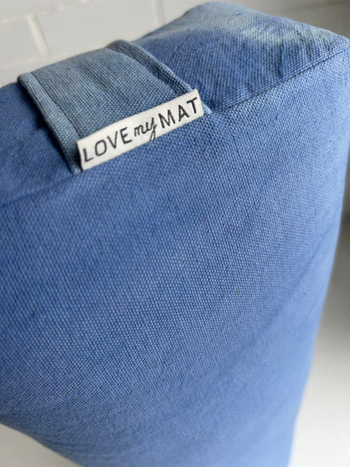 Blue yoga mat with 'LOVE my MAT' label on a white background