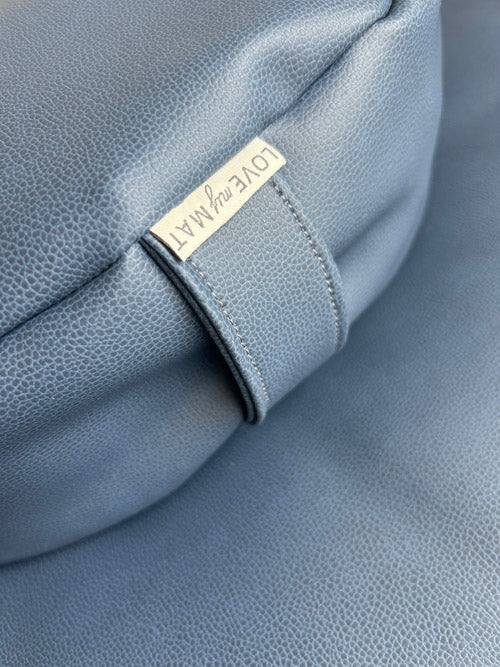 Close up of a blue vinyl meditation sit set