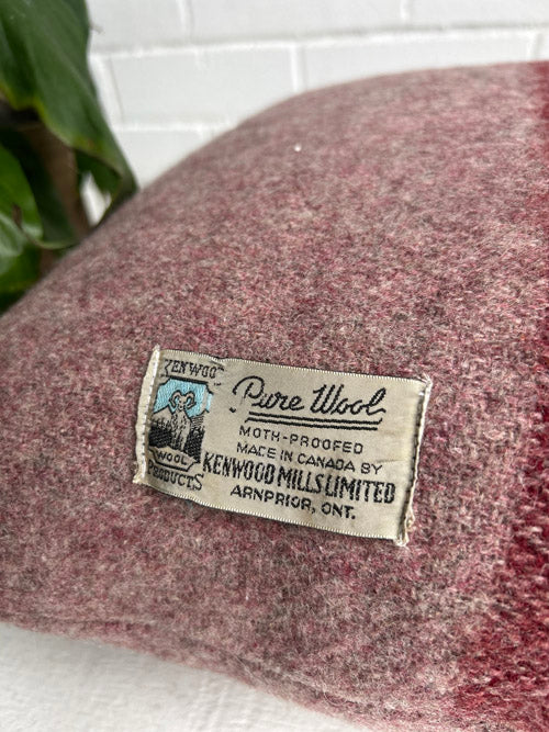 Woolen product with a label on a white surface