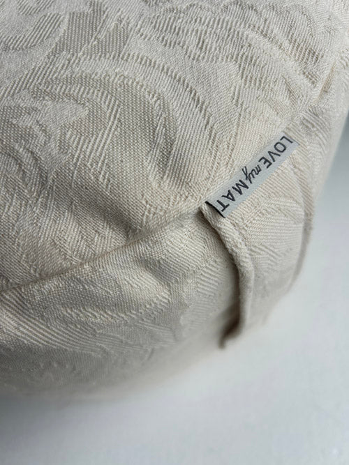 Textured pillow with a 'LOVE MY MAT' label on a white background
