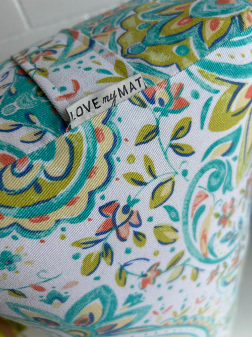Colorful patterned mat with 'LOVE my MAT' label on a white background