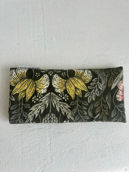 Floral patterned relaxation eye pillow on a white background