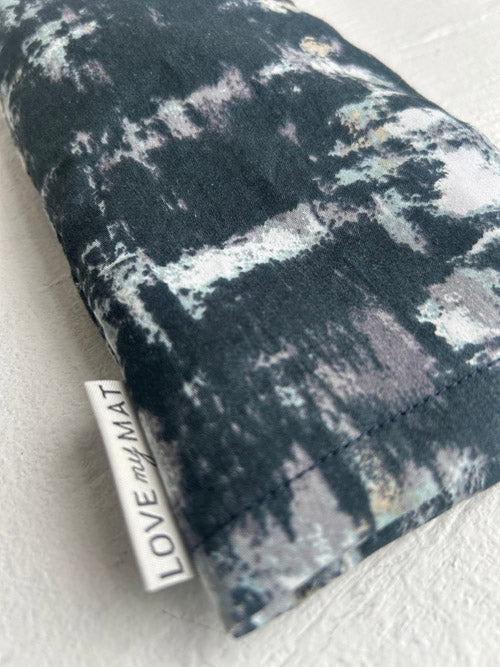 Abstract pattern eye  pillow with 'LOVE me MAT' label on a light background