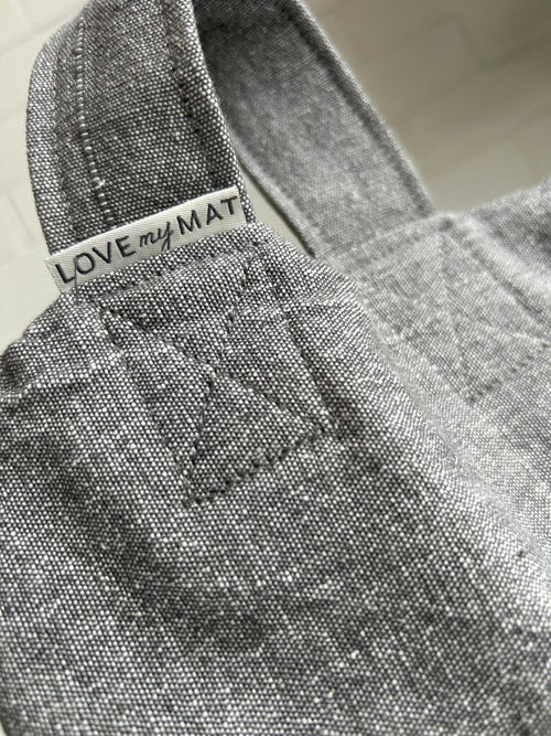 Gray textured sandbag with 'LOVE my MAT' label on a light background