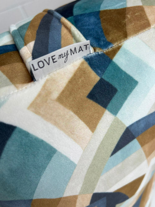 Geometric patterned yoga bolster with 'LOVE my MAT' label