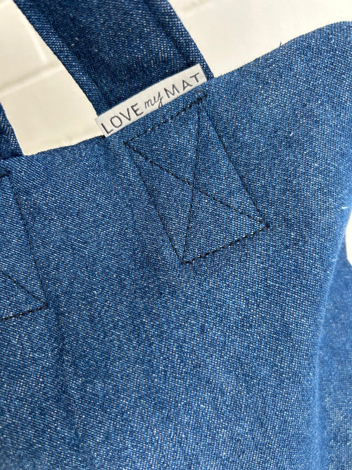 Blue denim fabric sandbag with a 'LOVE MY MATE' label.