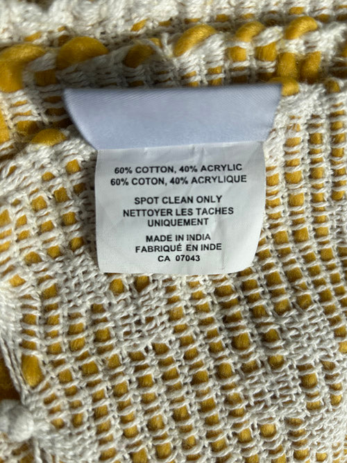Fabric with a label detailing material composition and care instructions.