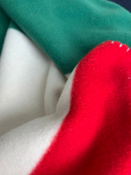 Close-up of green, white, and red fabric swatches.