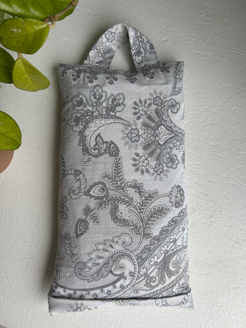 Decorative 10 lbs sandbag with paisley pattern on a light gray background
