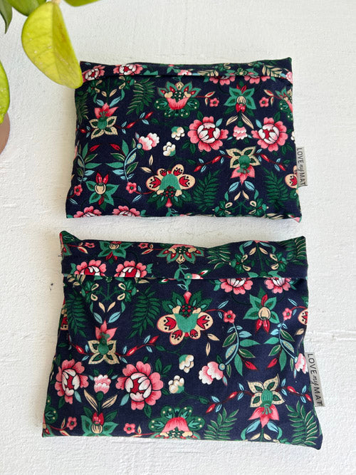 Two floral-patterned hand Weights on a white background