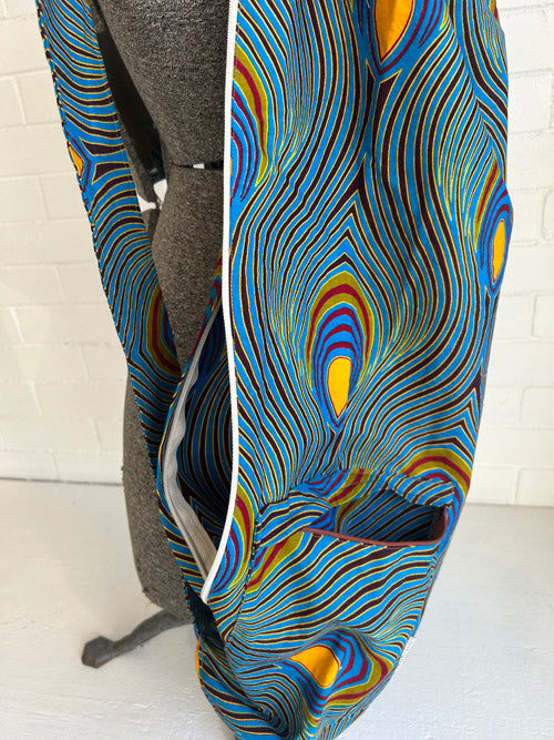 Colorful peacock feather pattern ed yoga mat bag on a white background