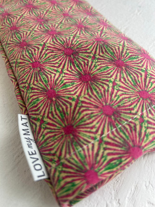 Patterned eye pillow with 'LOVE MY MAT' label on a white background