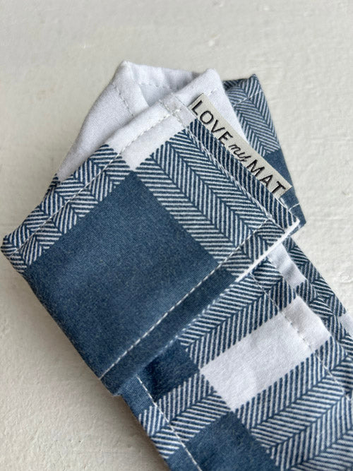 Yoga Mat Strap with a checkered pattern and 'LOVE and MAT' label on a light gray background