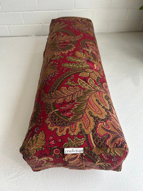 Decorative Yoga Bolster with intricate patterns on a white surface