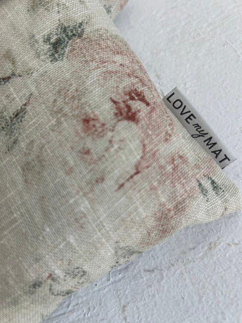 Textured fabric Handweights with a visible stain and 'LOVE my MAT' tag on a light background