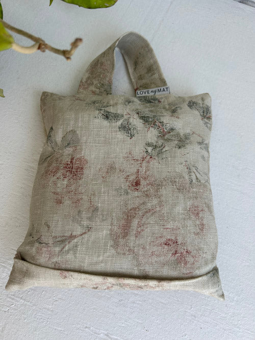 Floral-patterned Yoga Sandbag with a visible brand label on a light background