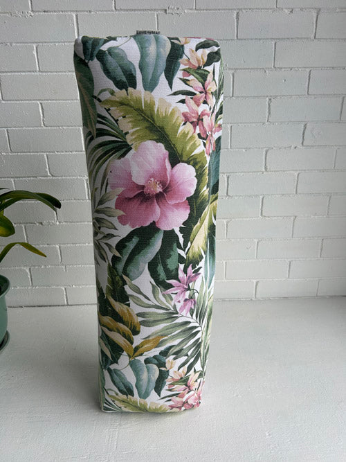 Tropical patterned Yoga Bolster on a white surface and against a white background 