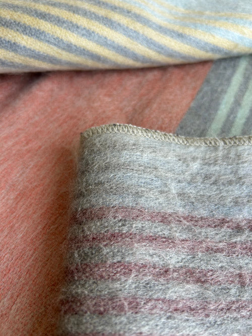 Close-up of striped fabric with a focus on texture and pattern.